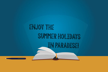 Handwriting text Enjoy The Summer Holidays In Paradise. Concept meaning Go beautiful places in holiday season Color Pages of Open Book photo on Table with Pen and Light Beam Glaring