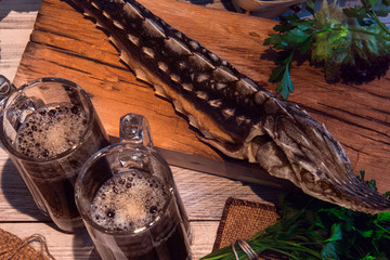 Dried sturgeon with dark beer and greens