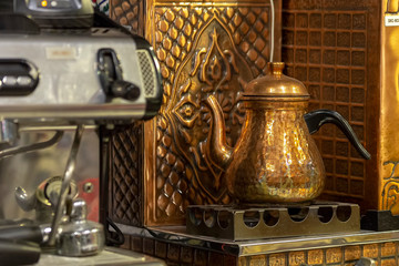 Turkish copper teapot. Drinking traditional Turkish Tea with kettle in cafe