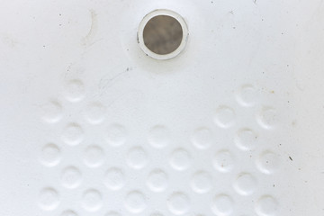 top view of round white pattern texture background on abandoned bathtub for anti slip without drain.