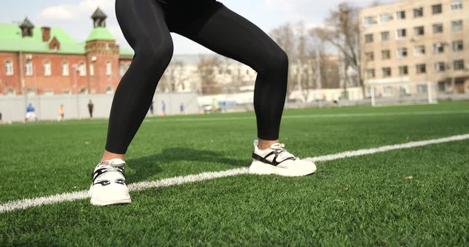 The girl is engaged in fitness at the stadium