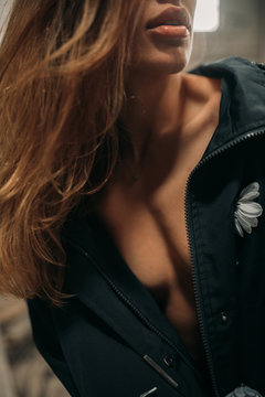 Portrait of a seminude woman with flowing hair.