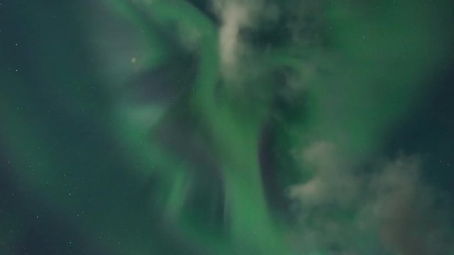 Timelapse of amazing Northern Lights at Lake Myvatn at night with beautiful landscape in view