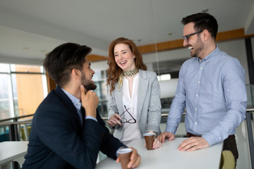 Business colleagues having conversation during coffee break