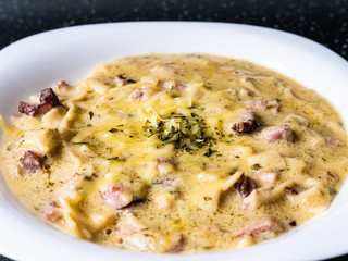 Ketogenic meal, creamy fat soup with meat, bacon and cheese