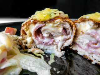 Ketogenic dish, pork meat stuffed with processed cheese and ham