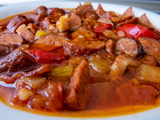 Ketogenic meal, fat Letcho with sausage, bacon, pepper and tomato