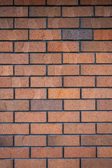 Horizontal brown brick wall.