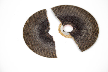 dangerous broken cracked cutting wheels abrasive safety work disc isolated white background photo close up