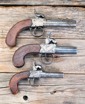 Antique Muff pistols.