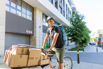 Bicycle messenger making a delivery on a cargo bike