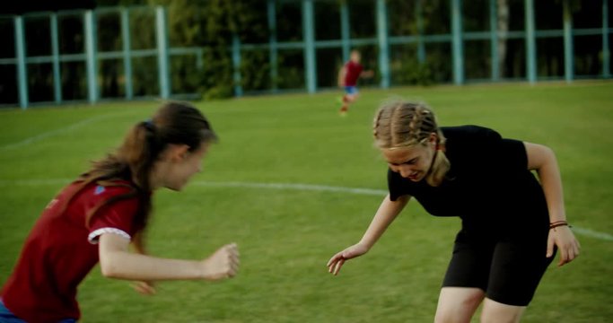 TRACKING Caucasian teenager girl soccer football team during practice. 4K UHD 60 FPS SLOW MOTION