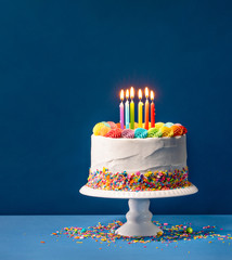 Colorful Birthday Cake over Blue - 272473644