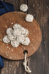 Obraz na płótnie Canvas Energy balls of nuts oats and dates with sesame seeds