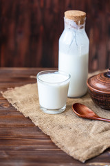 Homemade kefir, yogurt with probiotics in a glass on table Probiotic cold fermented dairy drink Trendy food and drink Copy space Rustic style.