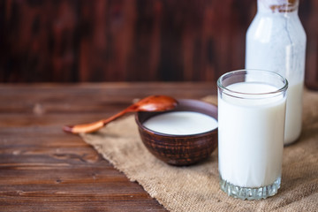 Homemade kefir, yogurt with probiotics in a glass on table Probiotic cold fermented dairy drink Trendy food and drink Copy space Rustic style.