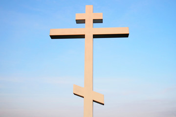 Christian cross against blue sky