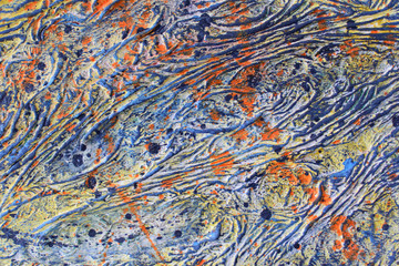 Background of old dried paint, bubbles and wrinkles, thick layer. Close-up.Fancy random color...
