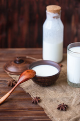 Homemade yogurt in a cup, a glass of kefir with probiotics Probiotic cold fermented dairy drink Trendy food and drink Copy space Rustic style.