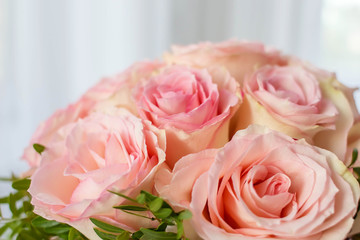 Beautiful Wedding bouquet of pink roses close up. The concept of marriage and love.