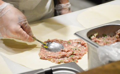 Chef prepares cheburek