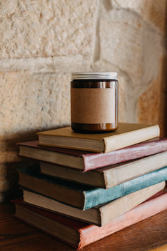 Candle Sitting on Top of Vintage Books