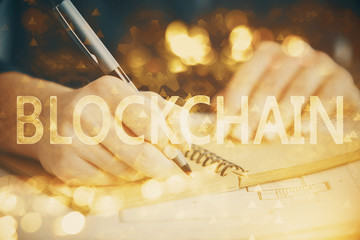 Cryptocurrency hologram over hands taking notes background. Concept of blockchain. Multi exposure