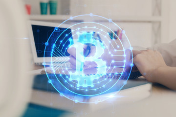 Cryptocurrency hologram over hands taking notes background. Concept of blockchain. Multi exposure