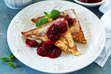French toast with cherry sauce.
