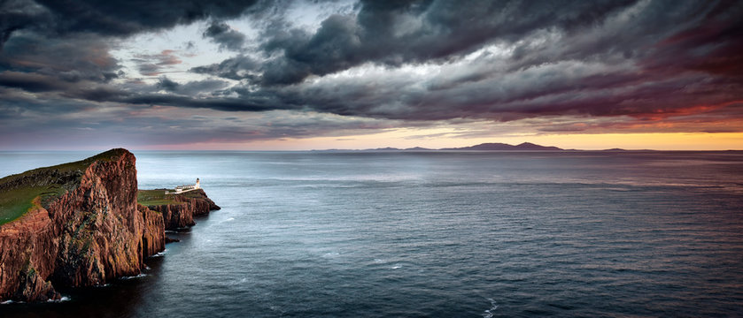 A lighthouse on a rocky outcrop