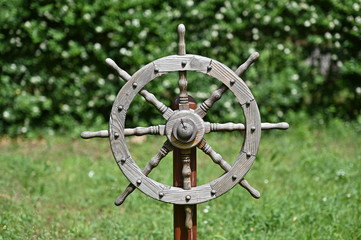 A wooden rudder of a sailing ship placed on a tombstone. The tombstone of a sailor. © Frank Middendorf