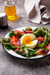 Healthy salad with prosciutto, tomato and egg