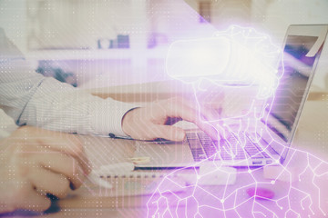 AR hologram with man working on computer on background. Augmented reality concept. Double exposure.