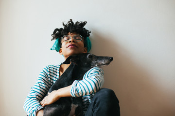 Woman spending time with her dog indoor