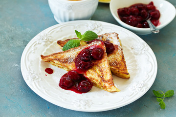 French toast with cherry sauce.
