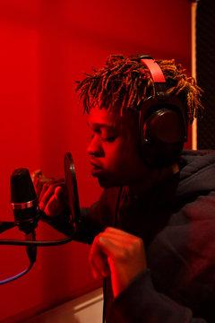 African-American man singing in studio