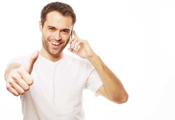 Fototapeta premium casual young man showing thumbs up sign