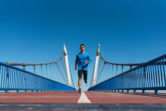 Handsome man running in the city.