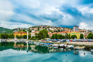 Rijeka, Croatia: Rjecina river with Liberation Monument, boats and view over the city and Trsat...
