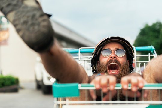 Funny bearded hipster enjoying in the street.