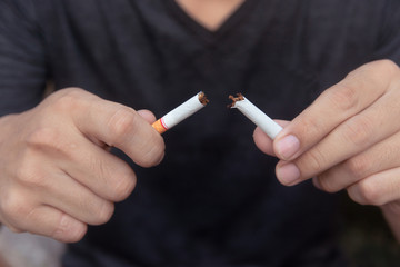 Stop cigarette, man hands breaking the cigarette with clipping path