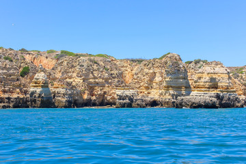 Fototapeta na wymiar Panoramic landscape view of golden cliffs and emerald water in Ponta da Piedade, Lagos, Algarve, Portugal