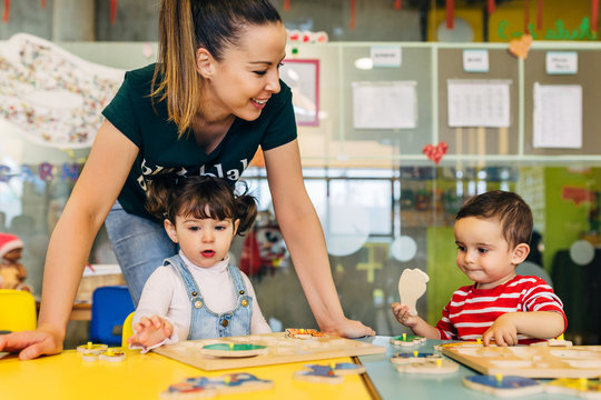 Little kid playing in kindergarten