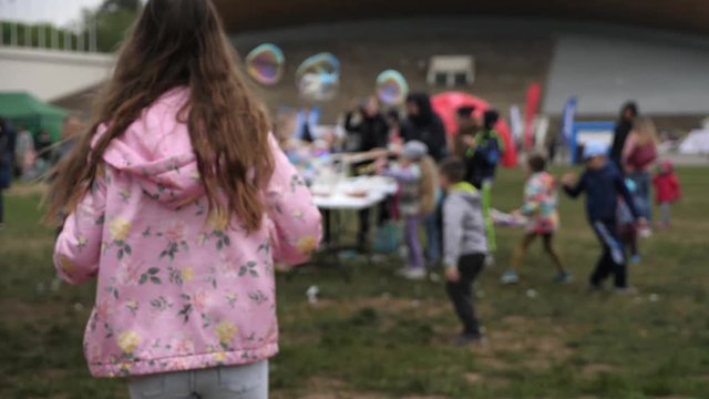 kids playing with bubbles in bubble festival