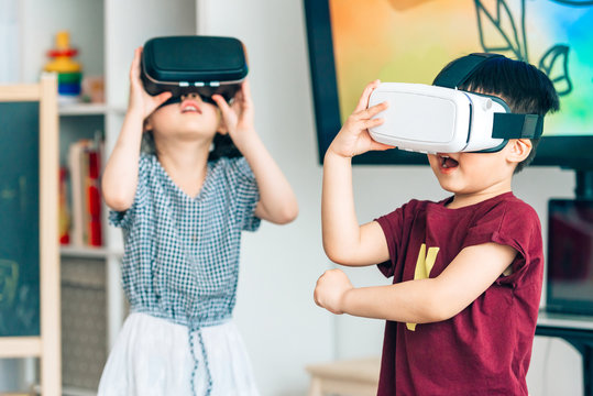 Preshool kids wearing virtual reality headset in classroom