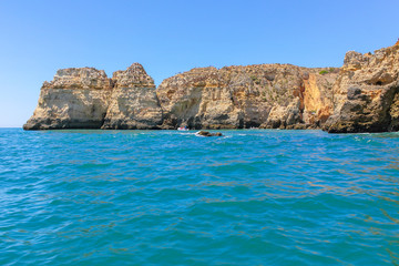 Algarve, panoramic landscape view of golden cliffs and emerald water in Ponta da Piedade, Lagos, Algarve, Portugal