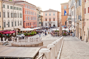 Naklejka premium Ancona, Italy - June 8 2019: People enjoying summer day and food at outdoor restaurant and resting.