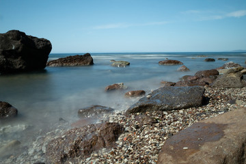 Fototapeta na wymiar sea with beach and stones in the sea