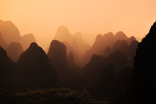 Scenic view of mountain range during sunset
