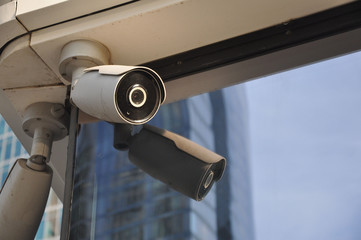 closed circuit camera Multi-angle CCTV system against the blue sky.